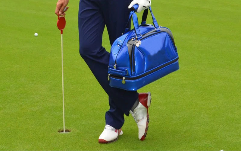 A-man-carries-a-Golf-Boston-Bag-on-the-course